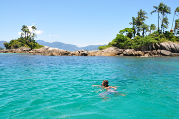 Young Male Enjoying and Swimming the Rio do Janeiro tropical Sea