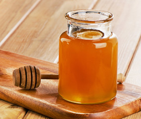 Glass jar of honey