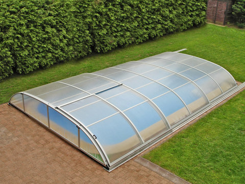 Outdoor swiming pool with a shelter