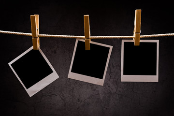 Photography paper with instant photo frames attached to rope wit