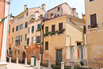 Fototapeta na wymiar House on a narrow street in the Italian city of Venice, Italy
