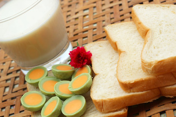 Obraz na płótnie Canvas fresh milk and bread plate with chocolate green.