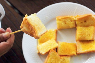 Toast with butter and sprinkling with sugar.