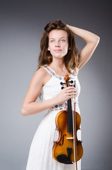 Woman artist with violin in music concept
