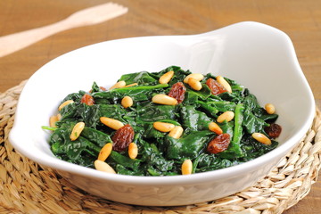 Sauteed spinach with raisins and pine nuts