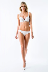 Fototapeta premium Slim girl in gold bikini