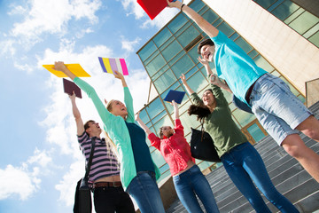 Happy students jumping for joy after the exam