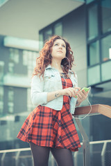 young beautiful hipster woman with red curly hair