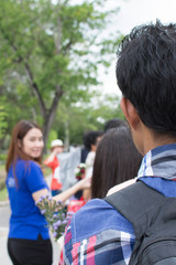 People waiting for on the bus at Mahidol University. The officer