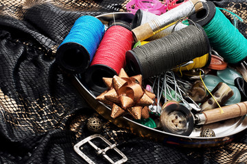thread,button,crochet hook, and other sewing tools