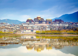 Fototapeta na wymiar Landscape with tibetan monastery and lake