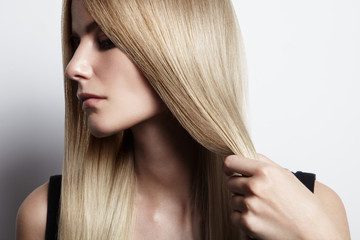 blondy woman holding her hair