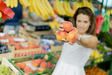 Fototapeta premium Young woman at the market