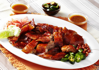 close up chinese duck roasted in white dish