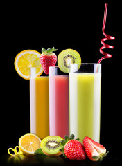 tasty summer fruits with juice in glass