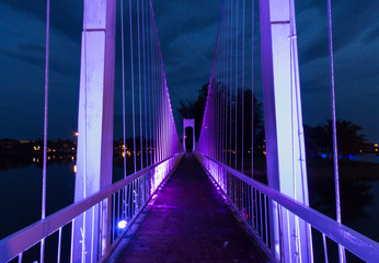 The metal rope bridge  in the park at twilight time