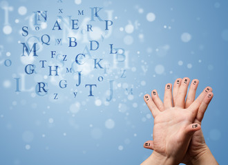 Happy smiley fingers looking at mixture of bokeh letters