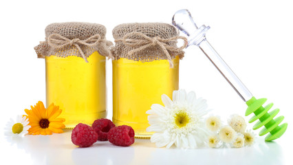 Jar full of delicious fresh honey and wild flowers, isolated