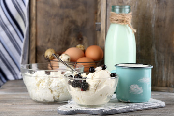 Dairy products and fresh eggs  on wooden background