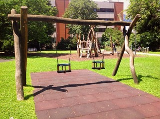 playground swings in urban park