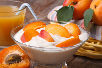 Apricot yoghurt and fresh juice closeup horizontal