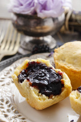 Muffins filled with blueberry and blackberry jam