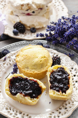 Muffins filled with blueberry and blackberry jam