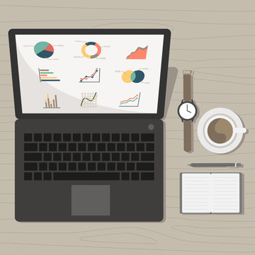 notebook with marketing graph and accessories on desk