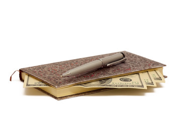 notepad with pen and cash