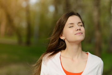 Fototapeta premium beautiful young woman in park enjoy weather