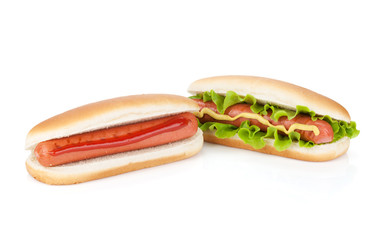 Two hot dogs with various ingredients