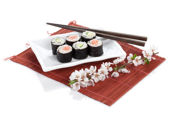 Sushi maki set with salmon and cucumber and sakura branch © evgeeenius