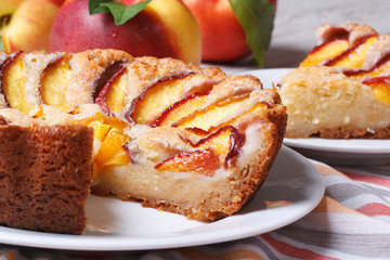 Cut peach pie on the table close-up. horizontal