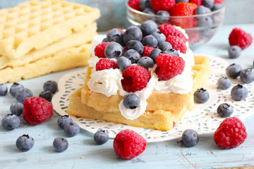 waffels with cream and berry fruits