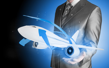 Businessman with airplane over his hand