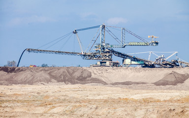 Opencast brown coal mine. Giant excavator.