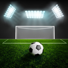 Soccer ball on green stadium arena