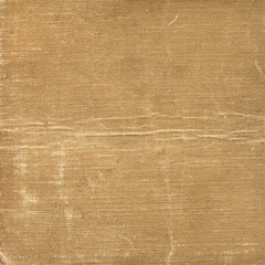 Fototapeta premium Canvas texture of aged vintage linen fabric displays a beige woven surface with natural creasing, ideal as a rustic background for graphic design, web backdrops, and print projects