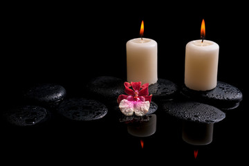 Beautiful spa concept of white and red orchid (cambria), candles