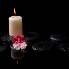 Beautiful spa concept of white and red orchid (cambria), candles