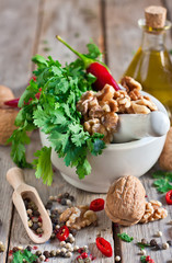 Cilantro and walnuts in a mortar