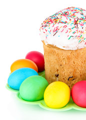 Sweet Easter cakes with colorful eggs isolated on white