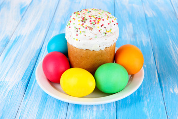 Sweet Easter cakes with colorful eggs on table close-up
