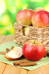 Naklejka na ściany i meble Ripe apples with with cinnamon sticks