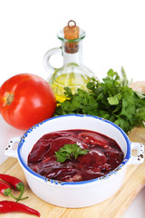 Raw liver in pan with spices and condiments isolated on white