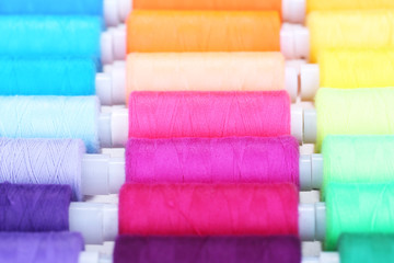 Multicolor sewing threads background