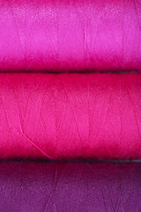 Multicolor sewing threads background