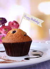 Blueberry muffin with chocolate sauce