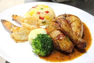 Chicken steak on white dish.