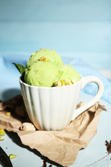 Tasty pistachio ice cream in cup